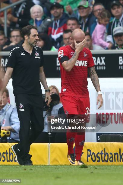Konstantin Rausch of Koeln is substituted with an injury during the Bundesliga match between Borussia Moenchengladbach and 1. FC Koeln at...