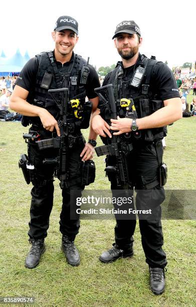 Armed Police Officers patrol during V Festival 2017 at Weston Park on August 20, 2017 in Stafford, England.