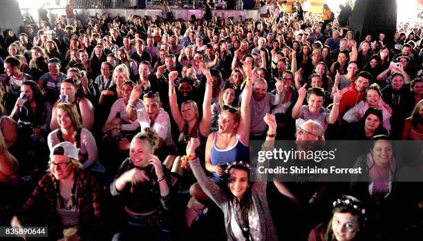 Festival goers enjoy V Festival 2017 at Weston Park on August 20, 2017 in Stafford, England.