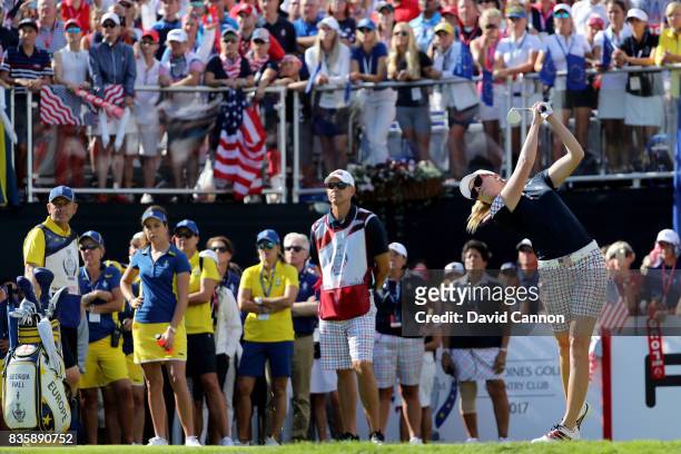 Paula Creamer of the United States team plays her tee shot on the first hole in her match against Georgia Hall of England and the European team...