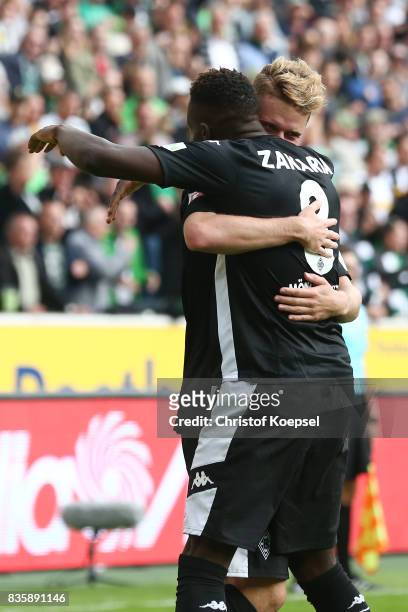 Nico Elvedi of Moenchengladbach celebrates having scored his teams first goal with Denis Zakaria of Moenchengladbach during the Bundesliga match...