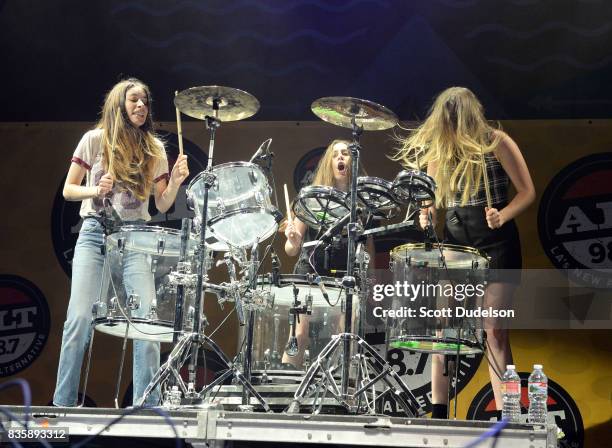 Singers Danielle Haim, Alana Haim, and Este Haim of the band HAIM perform onstage during the Alt 98.7 Summer Camp concert at Queen Mary Events Park...