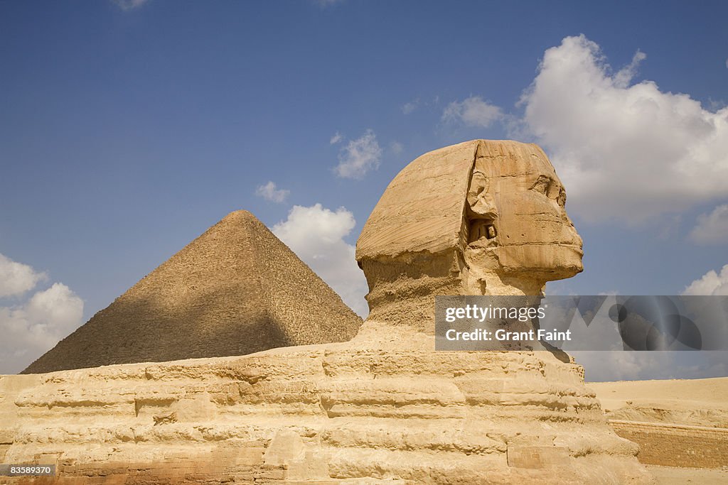 Side view sphinx and pyramid