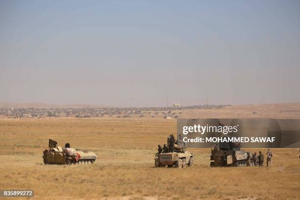 Iraqi government forces supported by fighters from the Abbas Brigade, which fights under the umbrella of the Shiite popular mobilisation units,...