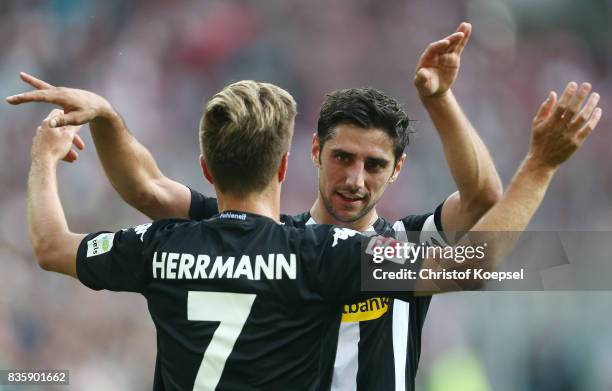 Patrick Herrmann of Moenchengladbach and Lars Stindl of Moenchengladbach celebrate after the Bundesliga match between Borussia Moenchengladbach and...