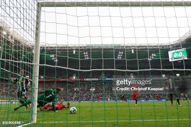 Nico Elvedi of Moenchengladbach scores his teams first goal past goalkeeper Timo Horn of Koeln during the Bundesliga match between Borussia...