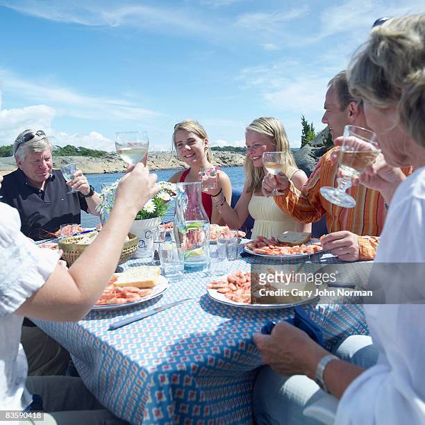 norwegian family enjoy family lunch - norway food stock pictures, royalty-free photos & images