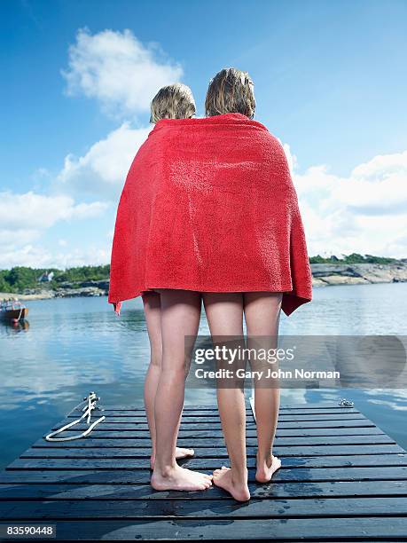 girl  wrapped in towel after swimming - kid girl towel stock pictures, royalty-free photos & images