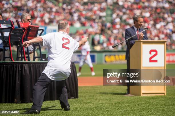 Broadcaster Jerry Remy is presented with a gift during a 30 year recognition ceremony before a game between the Boston Red Sox and the New York...