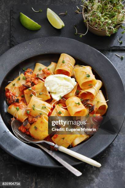 pasta with eggplant, tomato sauce and burrata - paccheri bildbanksfoton och bilder