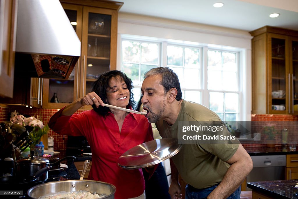 Mature couple cooking together