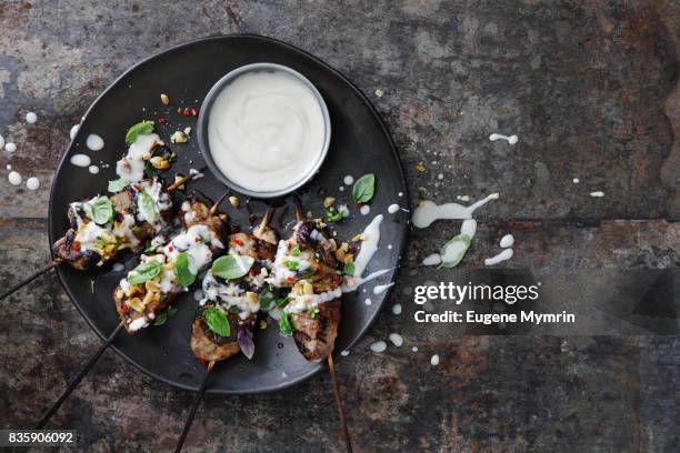 char-grilled tahini pork skewers - schweinebauch stock-fotos und bilder