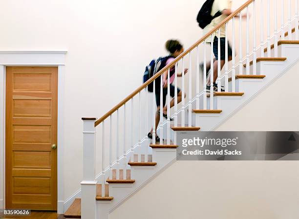 children running up stairs after school - tree house stockfoto's en -beelden