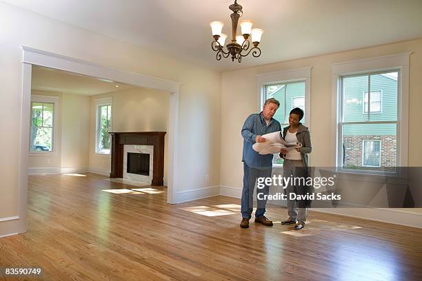 contractor discussing renovations  - home improvement contractor stock pictures, royalty-free photos & images