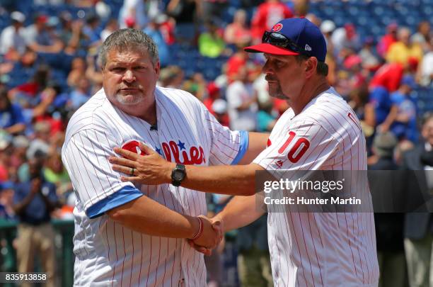 Former Philadelphia Phillies John Kruk and Mickey Morandini participate in Alumni Weekend ceremonies before a game between the Philadelphia Phillies...