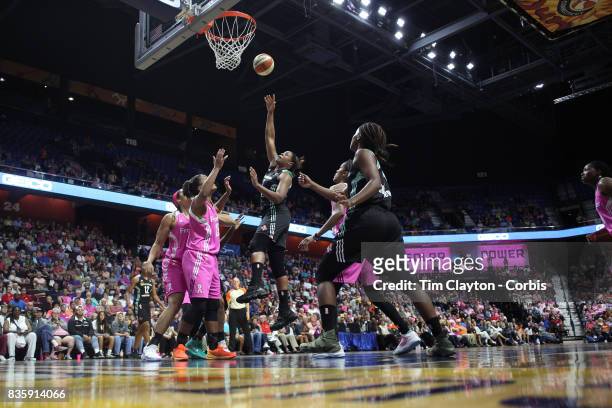 Kia Vaughn of the New York Liberty shoots while challenged by Alyssa Thomas of the Connecticut Sun during the Connecticut Sun Vs New York Liberty,...