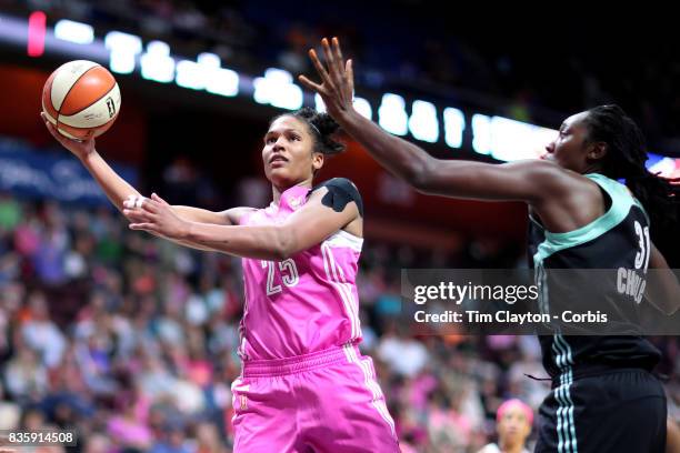 Alyssa Thomas of the Connecticut Sun shoots while defended by Tina Charles of the New York Liberty during the Connecticut Sun Vs New York Liberty,...