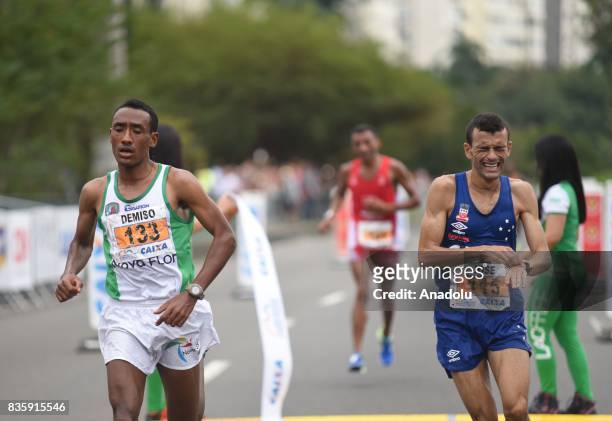 José Marcio Leão da Silva of Brazil and Demiso Legese Gudeta of Ethiopia run during the Rio de Janeiro International Half Marathon in Rio de Janeiro,...