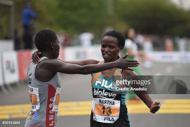 Martha Akeno and Esther Chesang Kakuri of Ethiopia congratulate each other after the Rio de Janeiro International Women's Half Marathon in Rio de...