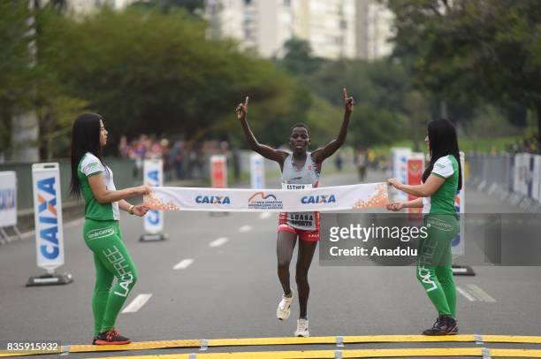 Esther Chesang Kakuri of Ethiopia crosses the finish line in second place during the Rio de Janeiro International Women's Half Marathon in Rio de...