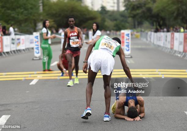 Demise Legion Gudeta of Ethiopia congratulates José Marcio Leão da Silva of Brazil after the Rio de Janeiro International Half Marathon in Rio de...