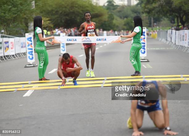Belete Adere Tola of Ethiopia crosses the finish line in fourth place during the Rio de Janeiro International Half Marathon in Rio de Janeiro, Brazil...