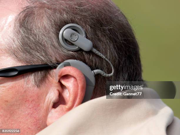 man with cochlear implant - cochlear implant stock pictures, royalty-free photos & images