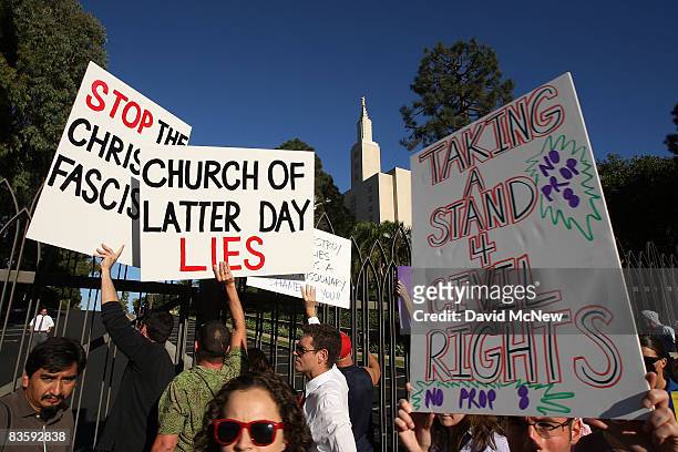 Hundreds of supporters of same-sex marriage demonstrate near the Los Angeles Mormon Temple, in the distance, before marching for miles in protest...
