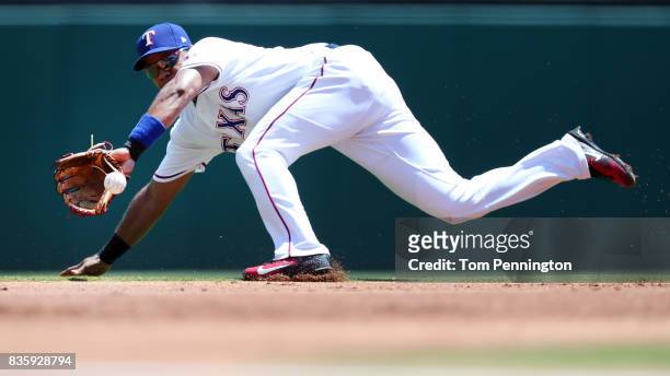 Elvis Andrus of the Texas Rangers fields a ground ball hit by Avisail Garcia of the Chicago White Sox in the top of the first inning at Globe Life...