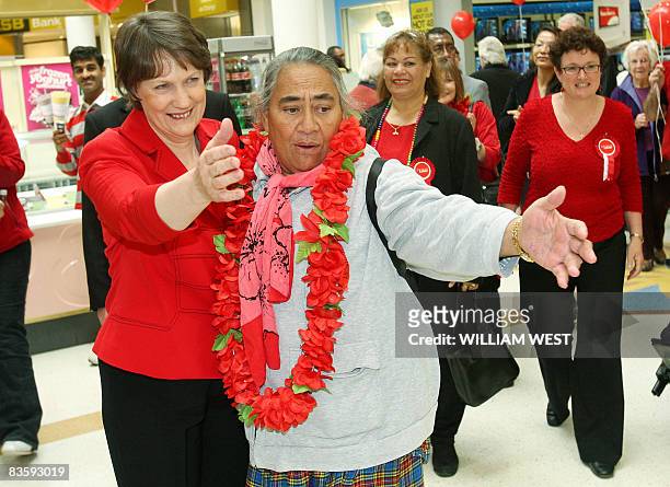 New Zealand's Labour Prime Minister Helen Clark is embraced by a supporter as she tours a shopping centre in Auckland's western suburbs, on November...