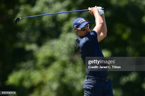 Henrik Stenson of Sweden plays his tee shot on the fifth hole during the final round of the Wyndham Championship at Sedgefield Country Club on August...