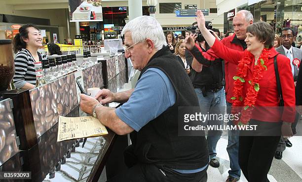 New Zealand's Labour Prime Minister Helen Clark greets supporters as she tours a shopping centre in Auckland's western suburbs, on November 7, 2008....