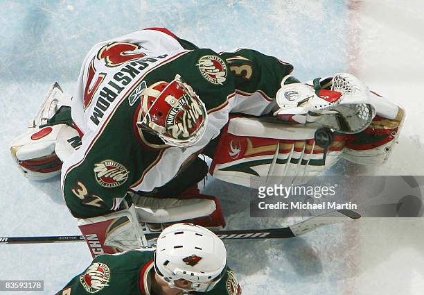 Goaltender Niklas Backstrom of the Minnesota Wild makes a save against the Colorado Avalanche at the Pepsi Center on November 06, 2008 in Denver,...