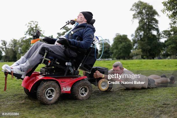 Rob Camm with his teammates during the 2017 Tough Mudder South West at Badminton Estate on August 20, 2017 in Cirencester, England.