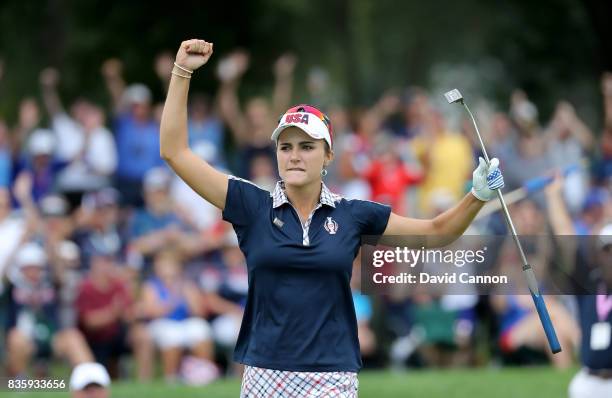 Lexi Thompson of the United States team plays her celebrates holing an eagle putt to win the 15th hole in her match against Anna Nordqvist of Sweden...