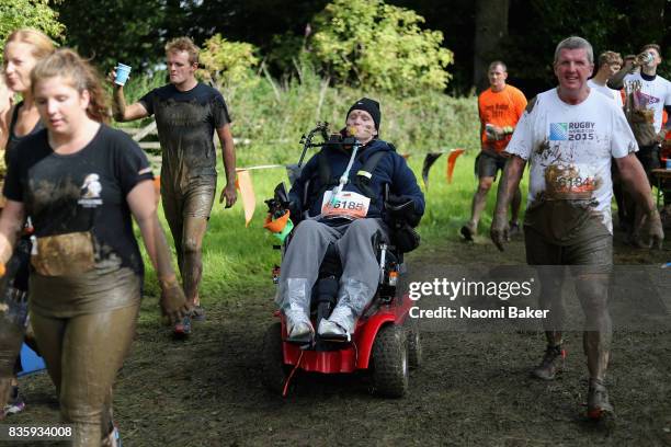 Rob Camm with his teammates during the 2017 Tough Mudder South West at Badminton Estate on August 20, 2017 in Cirencester, England.