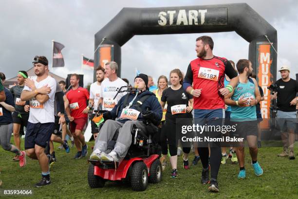 Rob Camm with his teammates during the 2017 Tough Mudder South West at Badminton Estate on August 20, 2017 in Cirencester, England.