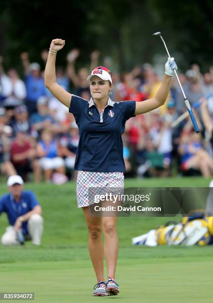 Lexi Thompson of the United States team plays her celebrates holing an eagle putt to win the 15th hole in her match against Anna Nordqvist of Sweden...