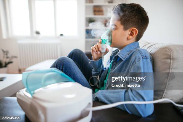inhalating at home - nebulizer stock pictures, royalty-free photos & images