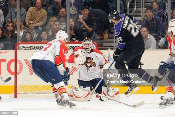 Anthony Stewart and Tomas Vokoun of the Florida Panthers defend the net as Michal Handzus of the Los Angeles Kings makes a shot on goal during the...