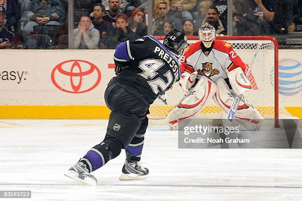 Tomas Vokoun of the Florida Panthers defends the net as Tom Preissing of the Los Angeles Kings makes a shot on goal during the game at Staples Center...