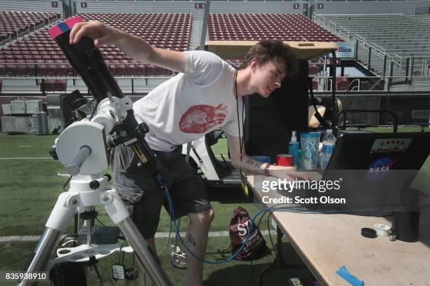 Mason Parrone, president of the Southern Illinois University astronomy club, tests his telescope before tomorrow's solar eclipse on August 20, 2017...