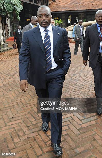 Congolese President Joseph Kabila steps out of the meeting room for a break on November 7 as he attends an emergency summit in Nairobi aimed at...