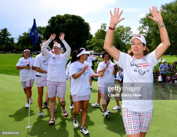 Captain Juli Inkster of Team USA celebrates a 16 1/2 to 11 1/2 win over Team Europe on the 17th green during the final day singles matches of the...