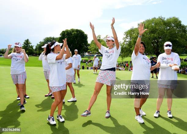 Lexi Thompson of Team USA celebrates victory over Team Europe during the final day singles matches of the Solheim Cup at the Des Moines Golf and...