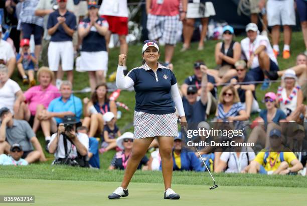 Lizette Salas of the United States team celebrates holing a putt on the 18th hole to win her match against Jodi Ewart Shadoff of the European team...