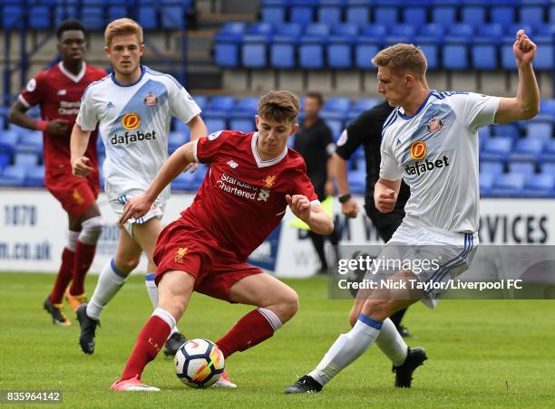 Ben Woodburn of Liverpool and Michael Ledger of Sunderland in action during the Liverpool v Sunderland U23 Premier League game at Prenton Park on...