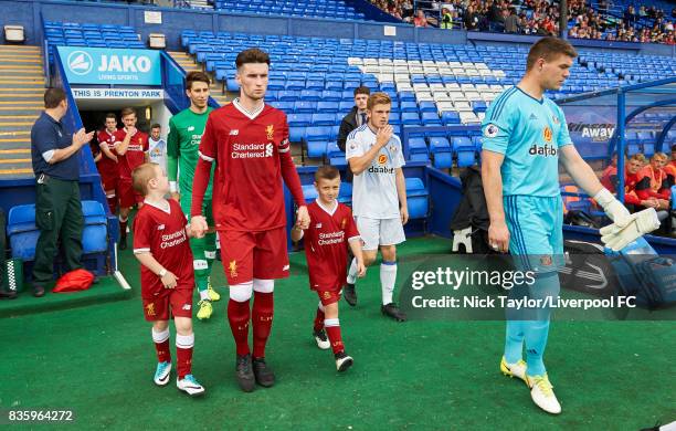 Corey Whelan of Liverpool leads his team out from the tunnel at the start of the Liverpool v Sunderland U23 Premier League game at Prenton Park on...