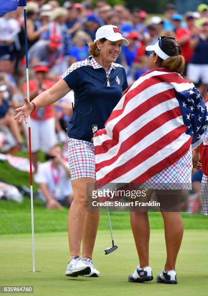 Juli Inkster, Captain of Team USA celebrates with Lizette Salas on the 18th hole during the final day singles matches of The Solheim Cup at Des...