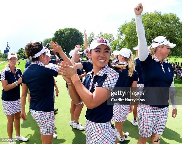Danielle Kang of Team USA celebrates victory over Team Europe during the final day singles matches of the Solheim Cup at the Des Moines Golf and...